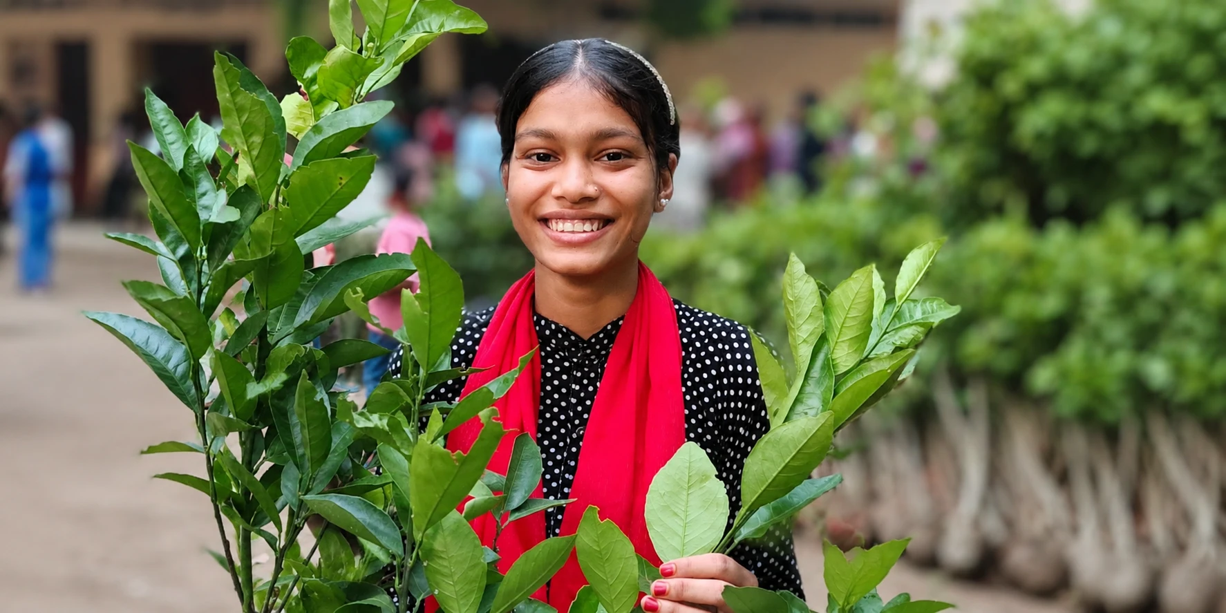 Smiling girl in a garden setting